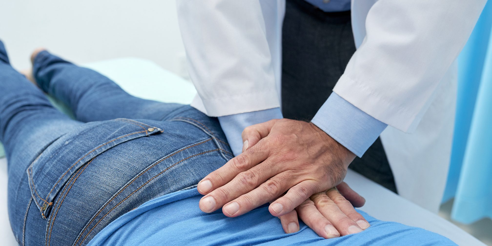 Adjusting back Chiropractor doing pushing motion to adjust back
